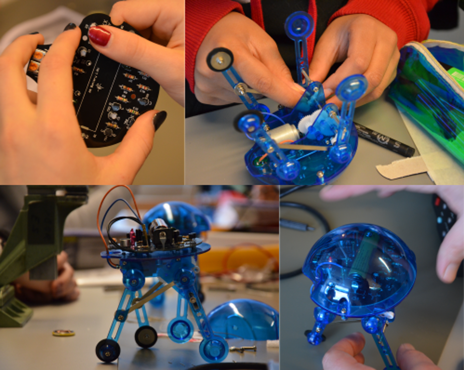 Mädchen bauen einen kleinen Roboter